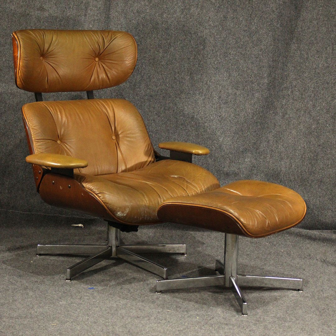 Eames for Herman Miller Style Lounge Chair: Eames for Herman Miller Style Lounge Chair with ottoman. Chair has bent ply wood outer shell with a vinyl leather type ulphostery . Chair looks vintage and shows appropriate age.