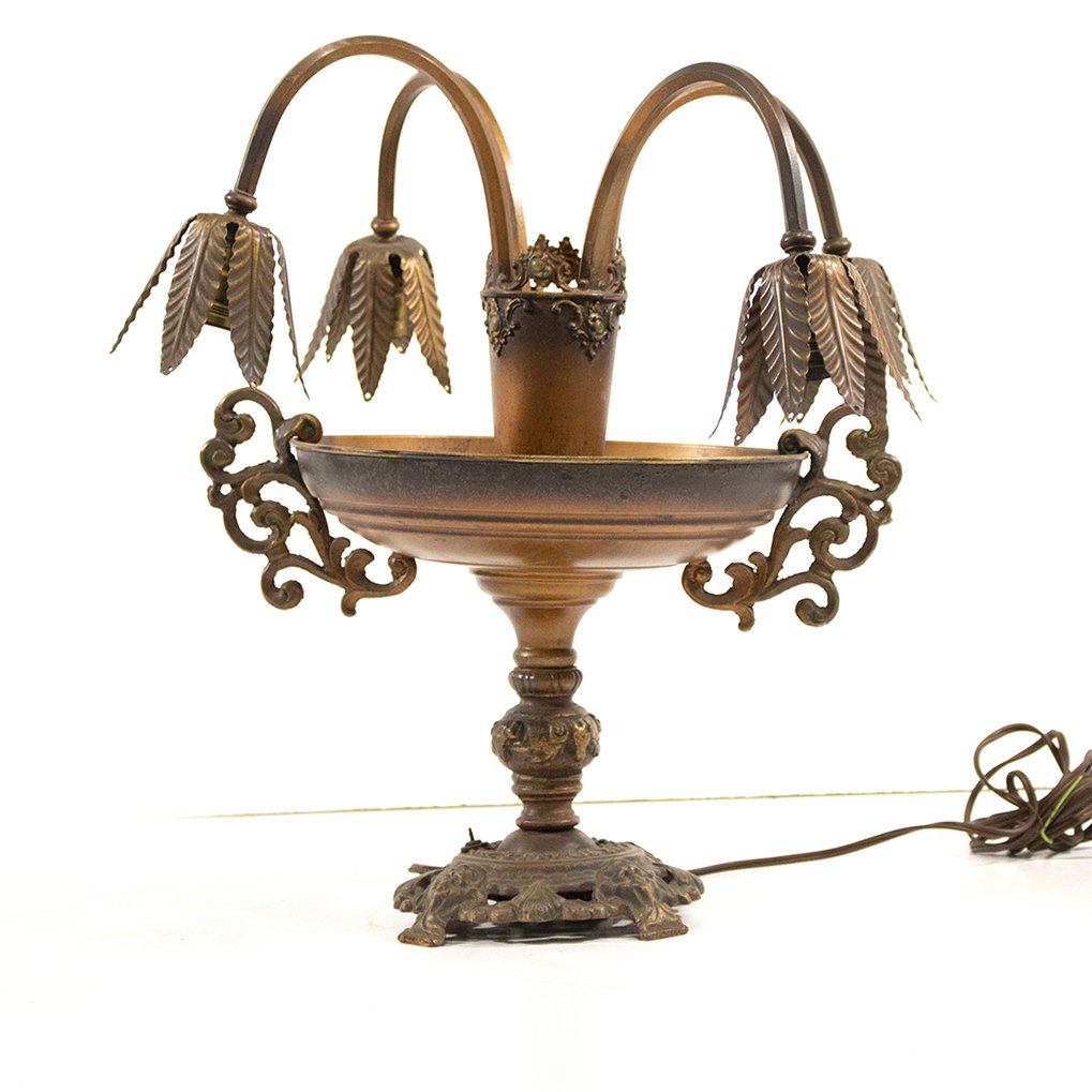 Metal Lilly Lamp 4 arm: Metal Lilly Lamp 4 arm on and handled urn. Size: 16 h , 18 w