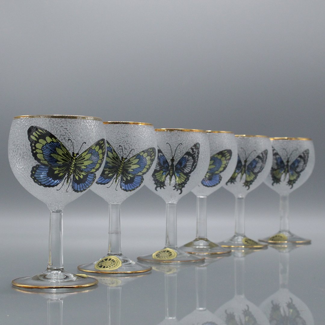 Six [6] Butterfly Italian Wine Glasses w/ Gold Trim: Six [6] Butterfly Italian Wine Glasses w/ Gold Trim . Cupped area or bowled part has a noise bump texture with transfer butterfly decorations, gold trim / rim. Size: 5 h