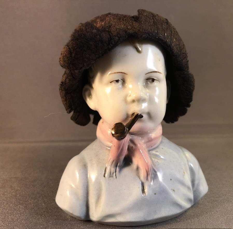 Vintage Porcelain Head Pin Cushion - Boy Smoking Pipe: Vintage Porcelain Head Pin Cushion - Boy Smoking Pipe, Very Unusual.Very good condition. Size: 3.5 in. height; 3 in. wide x 2 in. depth.