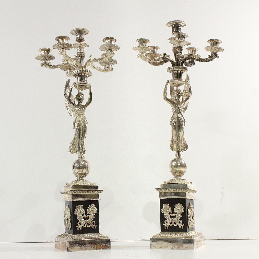 Two French Winged Maiden Silvered Bronze Candelabras: Two [2] Superb quality French Empire Silvered Bronze Tall Candelabras, Winged Maidens, Marble Mount Base. Good Silvered Finish. Size: 28 in. height, 11 in. wide.