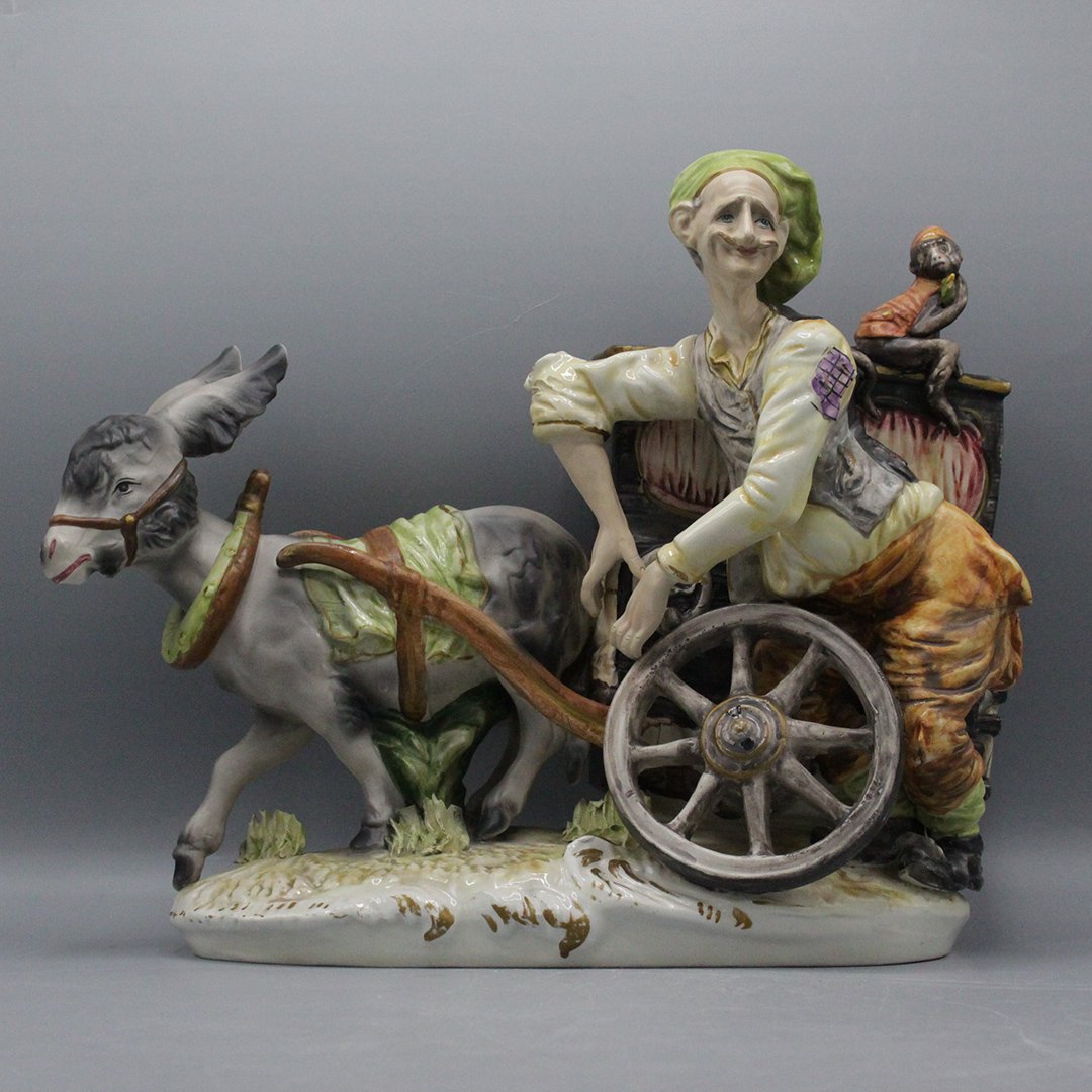 Vintage Italian Porcleian Musician Organ Grinder: Vintage Italian Porcleian Musician Organ Grinder with monkey. Organ is pulled by Donkey. Size: 11.5 x 14 inches