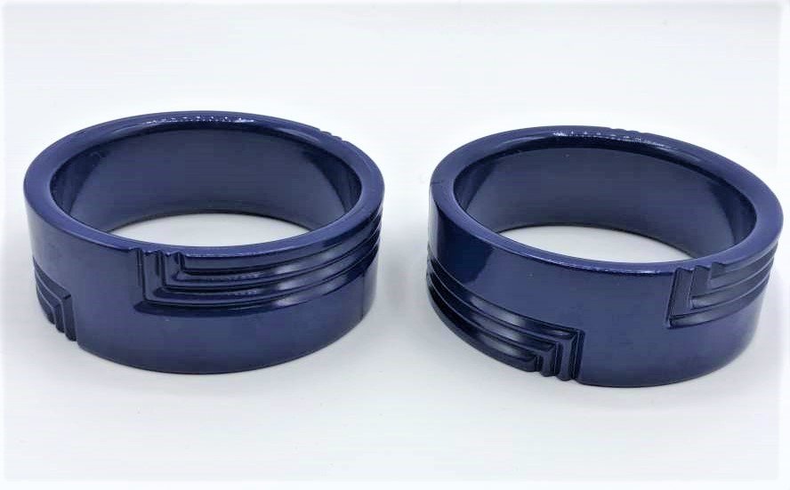 Two [2] Art Deco Blue Bakelite Wide Bangle Bracelets: Two [2] Art Deco Blue Bakelite Wide Bangle Bracelets, Made in Western Germany, original labels. Matched Pair, Incised Art Deco Lines Design. Size: 3 in. diameter, 1 1/8 in. wide.