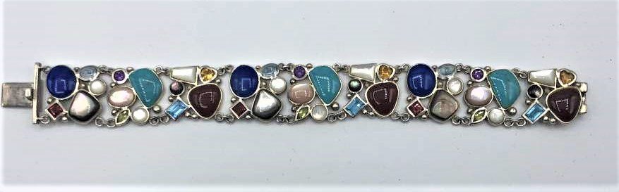 .925 Sterling Silver Multi Colored Stones Wide Bracelet: .925 Sterling Silver Multi Colored Stones Wide Bracelet. Marked: .925 ; Size: 7.5 in. length