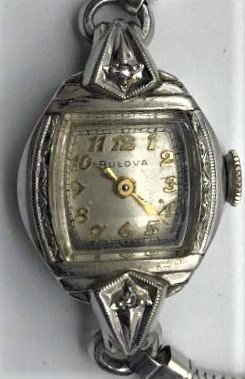 BULOVA 10K Rolled Gold with Diamonds Ladies Wristwatch: BULOVA 10K Rolled Gold with Diamonds Ladies Wristwatch. 12 K GF Band. Size Bezel: 1 in. x 5/8 in.