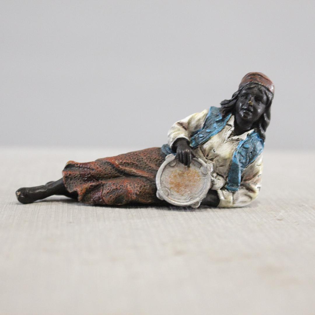 after Bergman Austrian Bronze Reclining Arabian Girl: after Bergman Austrian Bronze Reclining Arabian Girl with Tamborine. Original patina finish. Size: 2 x 3.5
