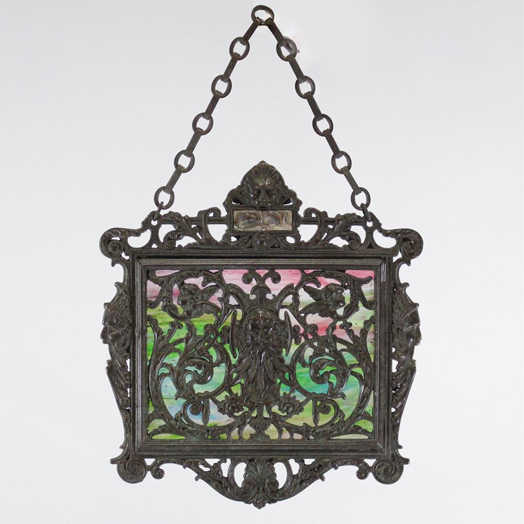 OSCAR BACH NEW YORK Signed Bronze & Slag Glass Plaque: OSCAR BACH NEW YORK Signed Bronze & Slag Glass Plaque hanging sun window. Signed om back: Oscar Bach, New York. Quality bronze casting. Original patina finish. Size: 13.5 x 12.5