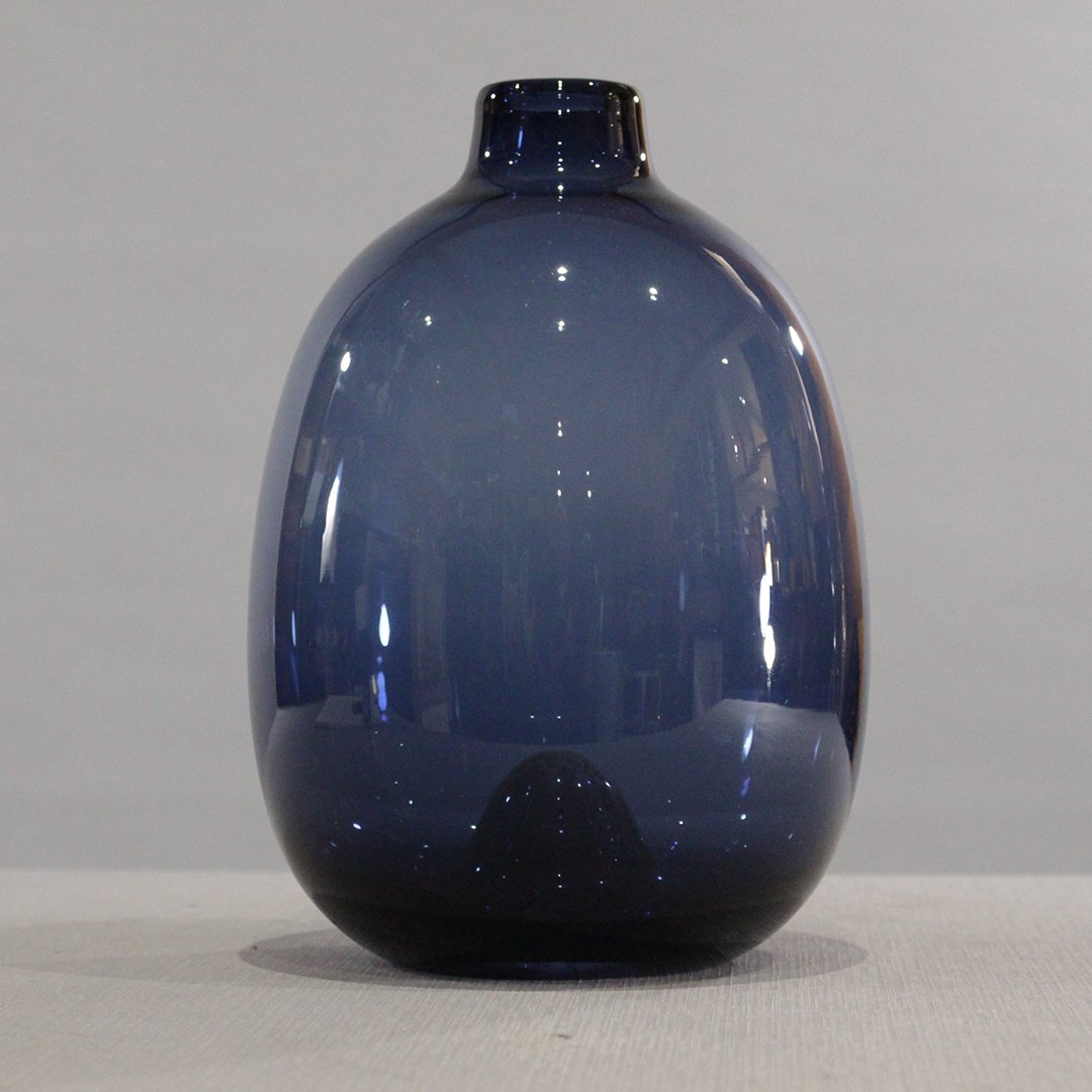 Mid-Century Modern Blue Glass Vase Polished Base: Mid-Century Modern Blue Glass Vase Polished Base. Good quality glass. Size: 10 in. height x 6.5 in. wide.