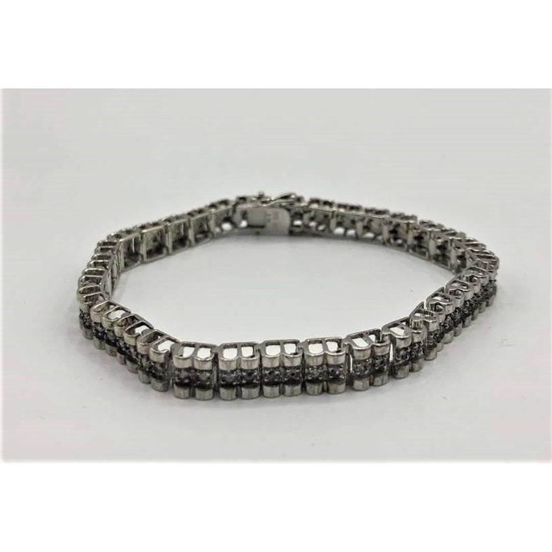 Sterling Silver and Diamonds Tennis Bracelet: Sterling Silver and Diamonds Tennis Bracelet. Nice quality. Size: 7.5 in. length