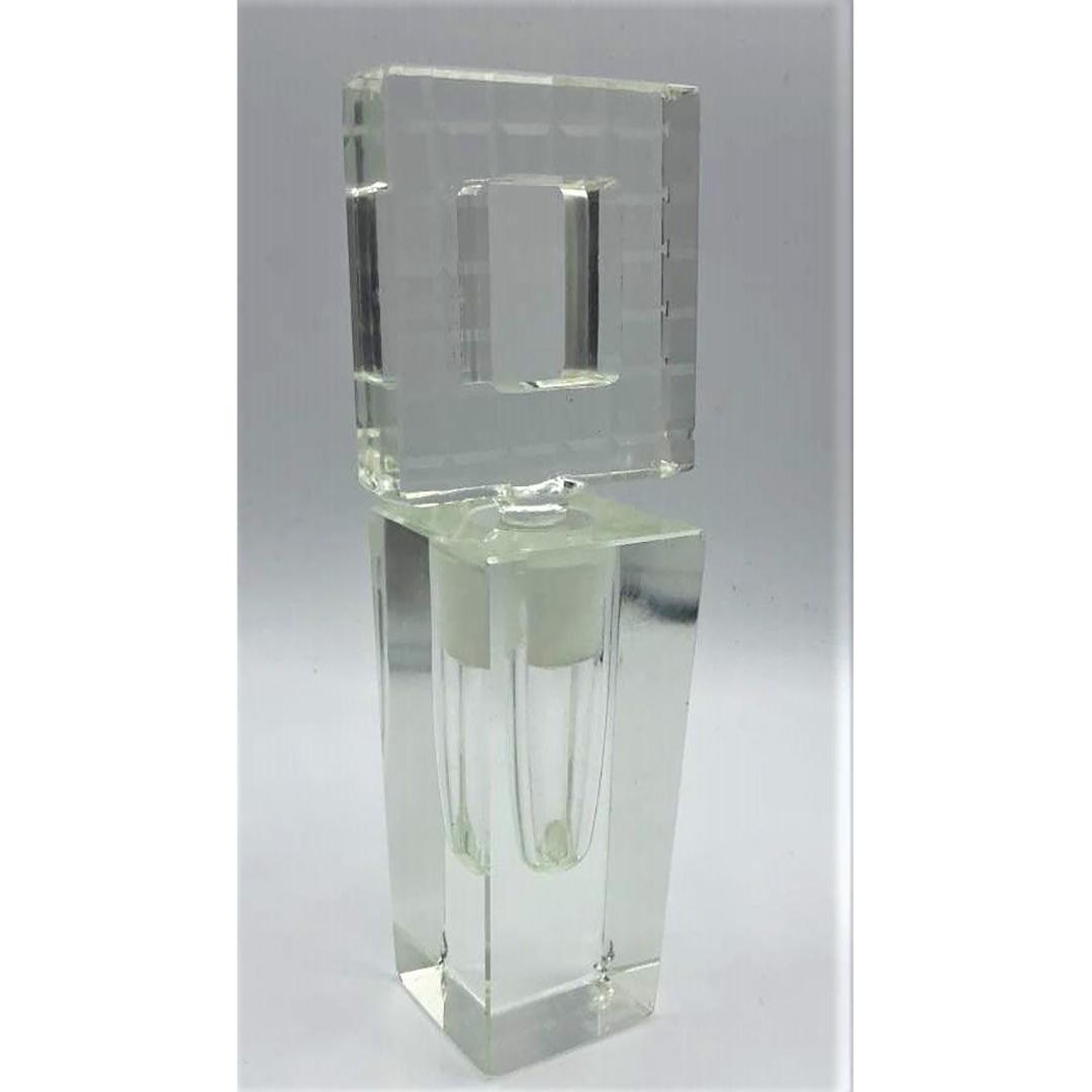 Art Deco Cut Crystal Glass Perfumer Faceted Design Top: Art Deco Cut Crystal Glass Perfumer Faceted Design Top. has small nick on base corner. Size: 7.5 in. height, 2.5 in. wide stopper, 2 in. wide bottom.