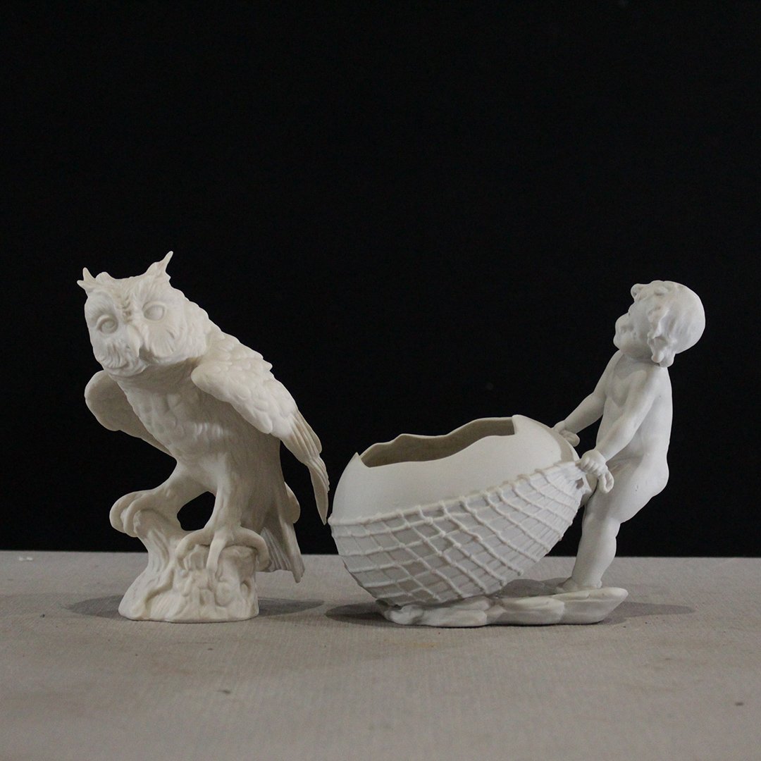 Goebel / Germany White Bisque Owl and Cupid Egg Cart: Goebel / Germany White Bisque Owl and Cupid Egg Cart. Size: 6.5 in. height, 6 in. wide and 6.5 in. height x 6 in. wide