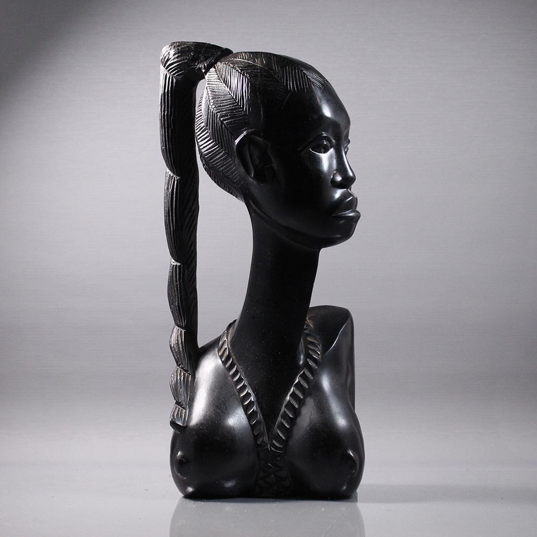 Black Ebony Carved Wood Bust of African Woman: Black Ebony Carved Wood Bust of African Woman. Size: 16.25 x 7 inches