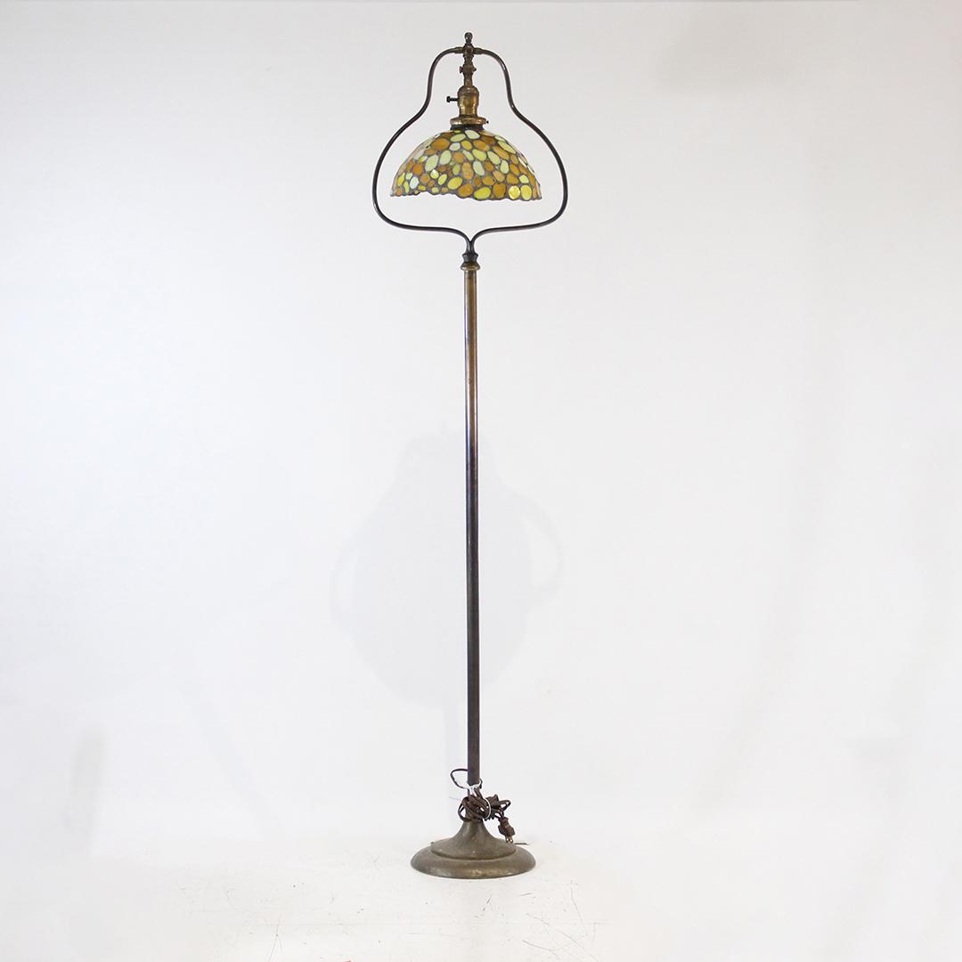 HANDEL Signed Brass Harp Floor Lamp Leaded Glass Shade: HANDEL Signed Brass Harp Floor Lamp Leaded Glass Shade. Base is Signed HANDEL, Shade not signed. Size: 57 in. x 13.25 in.