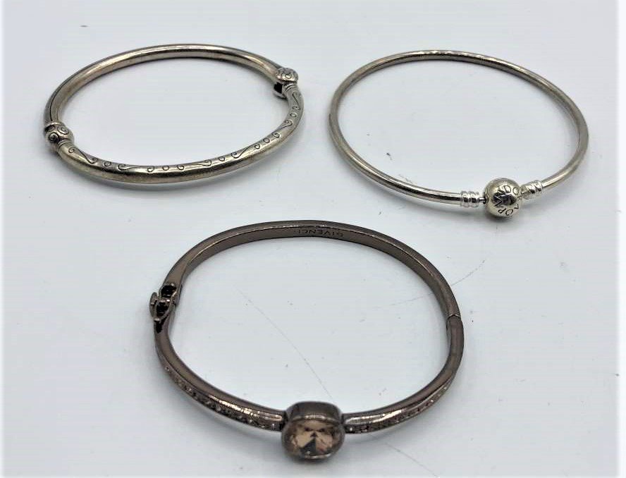 Three Assorted Bangle Bracelets: 2 Sterling 1 Givenchy: Three Assorted Bangle Bracelets: 2 Sterling 1 Givenchy. Size: 2.75 in. diameter