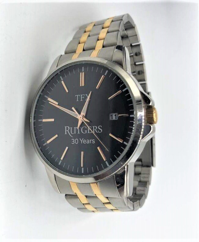 TFX Rutgers 30 Years Men's Wristwatch By Bulova: TFX Rutgers 30 Years Men's Wristwatch Distributed By Bulova. Like New in Original box with papers. Size: bezel 1.5 in. diameter