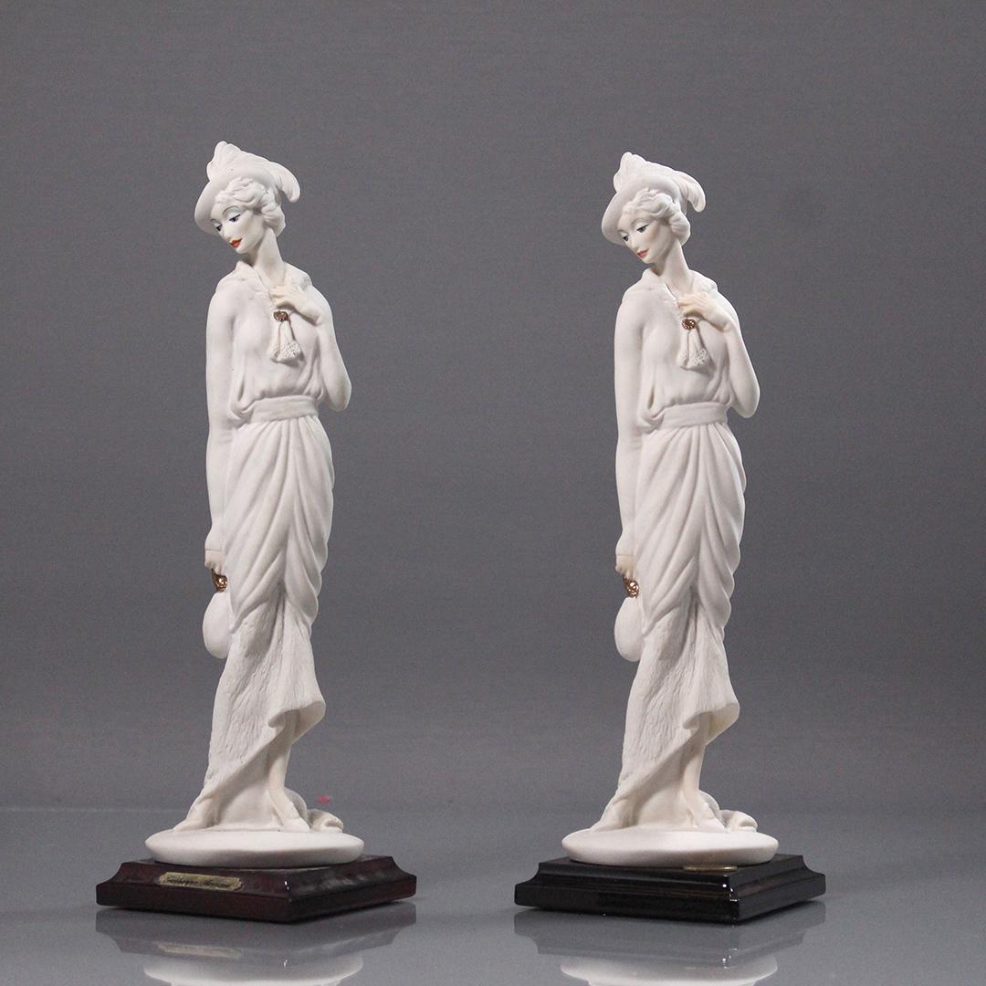 [2] Giuseppe Armani Porcelain Fashion Women Figurines: [2] Giuseppe Armani Porcelain Fashion Women Figurines. Size: 10.75 in. height, 3 in. wide.