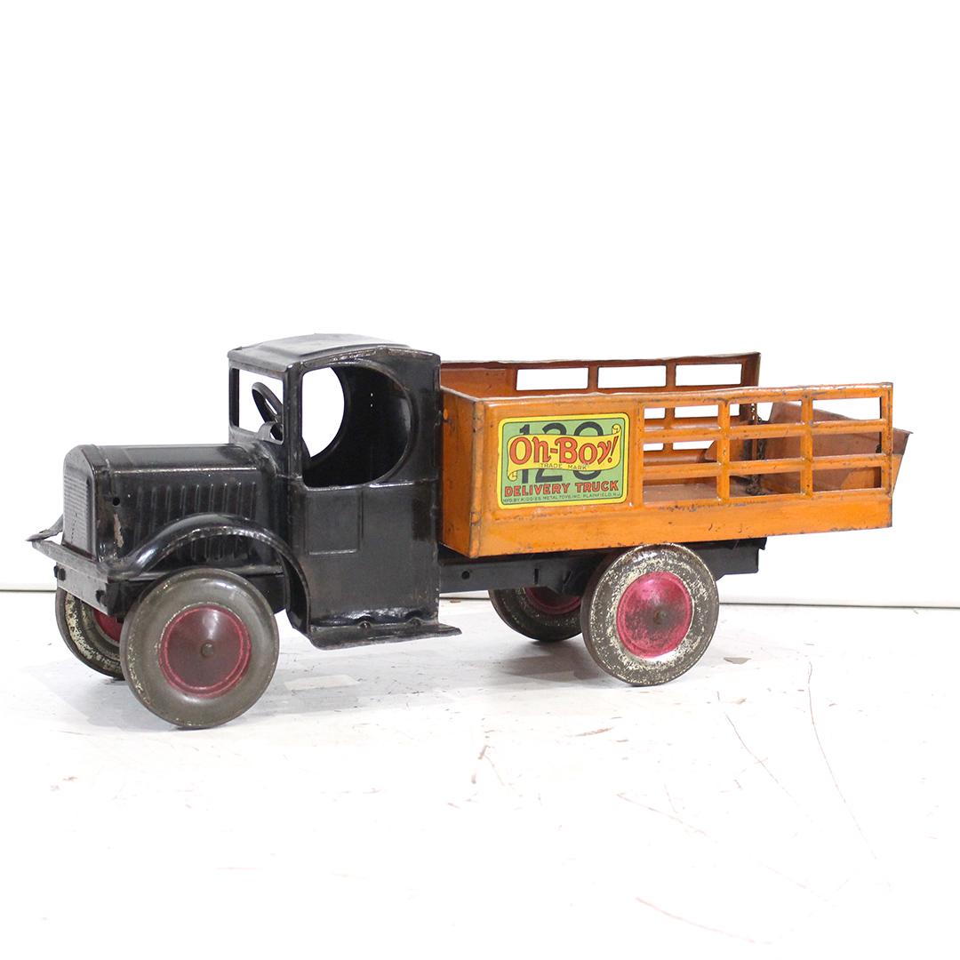 Antique Toy Pressed Steel Oh-Boy Delivery Truck: Antique Toy Pressed Steel Oh-Boy Delivery Truck. Clean, nice Label. Original paint. Size: 8 in. height, 19.5 in. length, 6.5 in. wide
