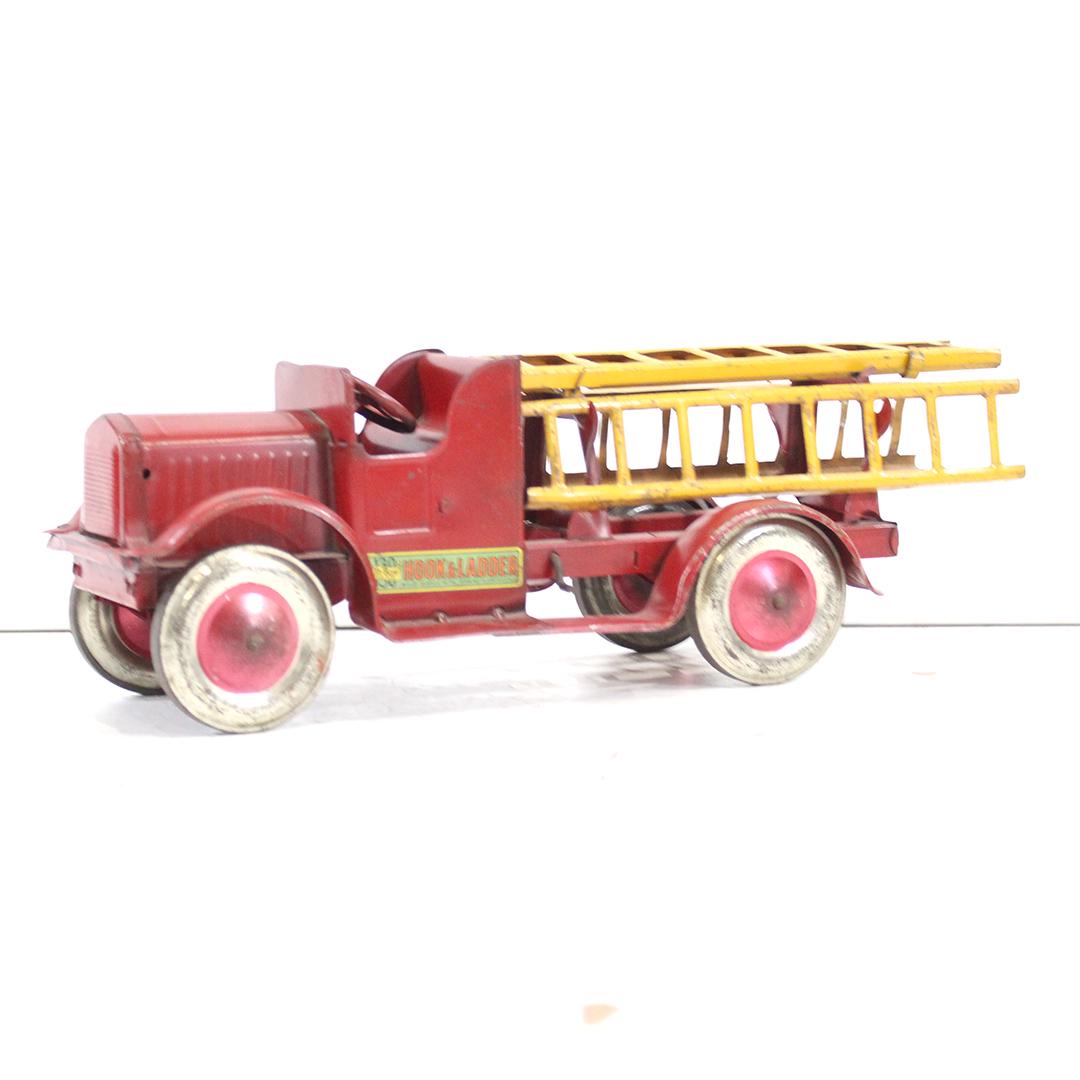 Antique Toy Pressed Steel Oh-Boy Hook & Ladder Truck: Antique Toy Pressed Steel Oh-Boy Hook & Ladder Fire Truck. Original red paint with yellow ladders, good label, clean. Size: 6.5 .in. height, 19 in. length, 6.25 in. wide