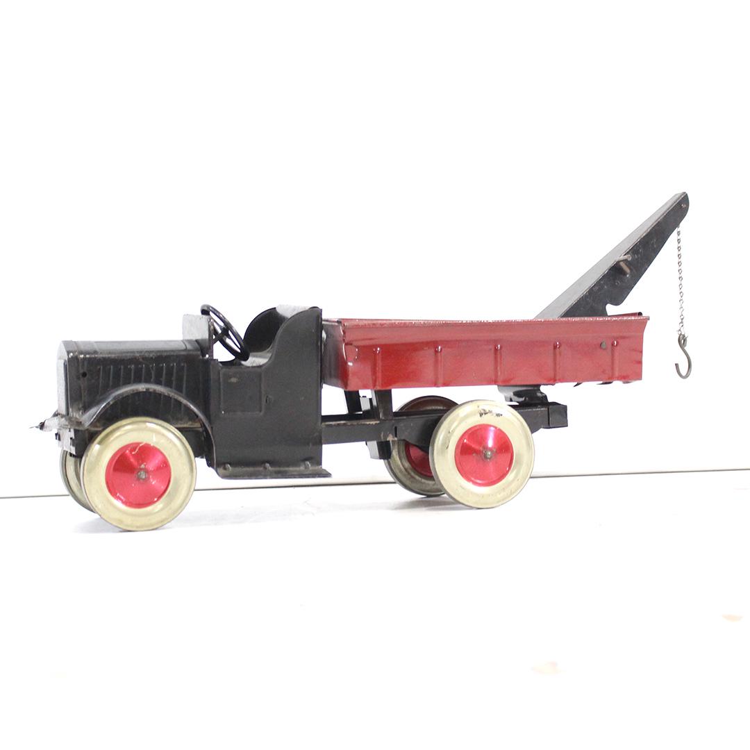 Antique Toy Pressed Steel Black & Red Tow Truck: Antique Toy Pressed Steel Black & Red Tow Truck. Clean. Size: 10 in. height, 22 in. length, 6.5 in. wide.