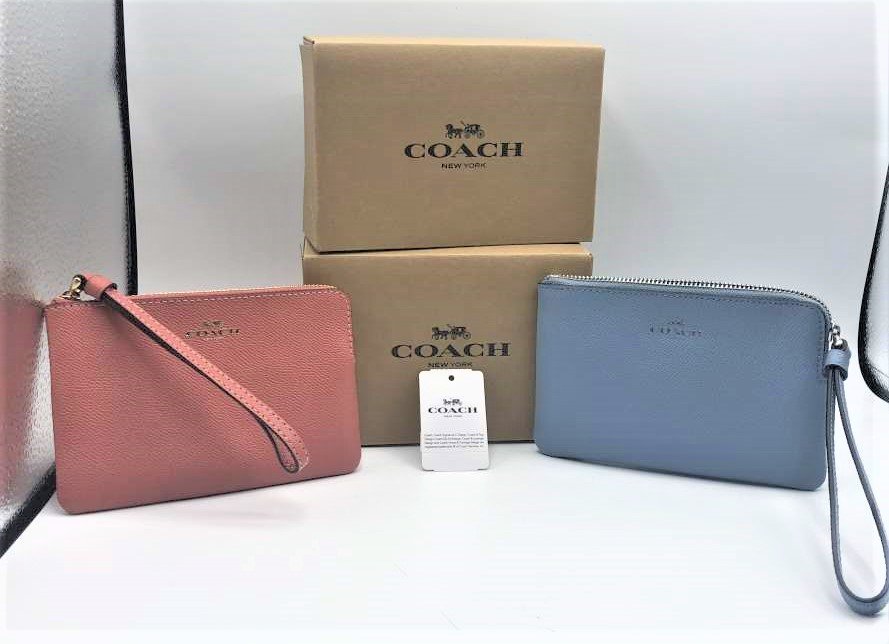Two [2] Coach Clutch Purses New in Boxes, Pink, Blue: Two [2] Coach Clutch Purses New in Boxes, Pink, Blue. With original boxes, wrap paper, sticker and price tag $69.99. Size: 6.25 in. x 4 in.