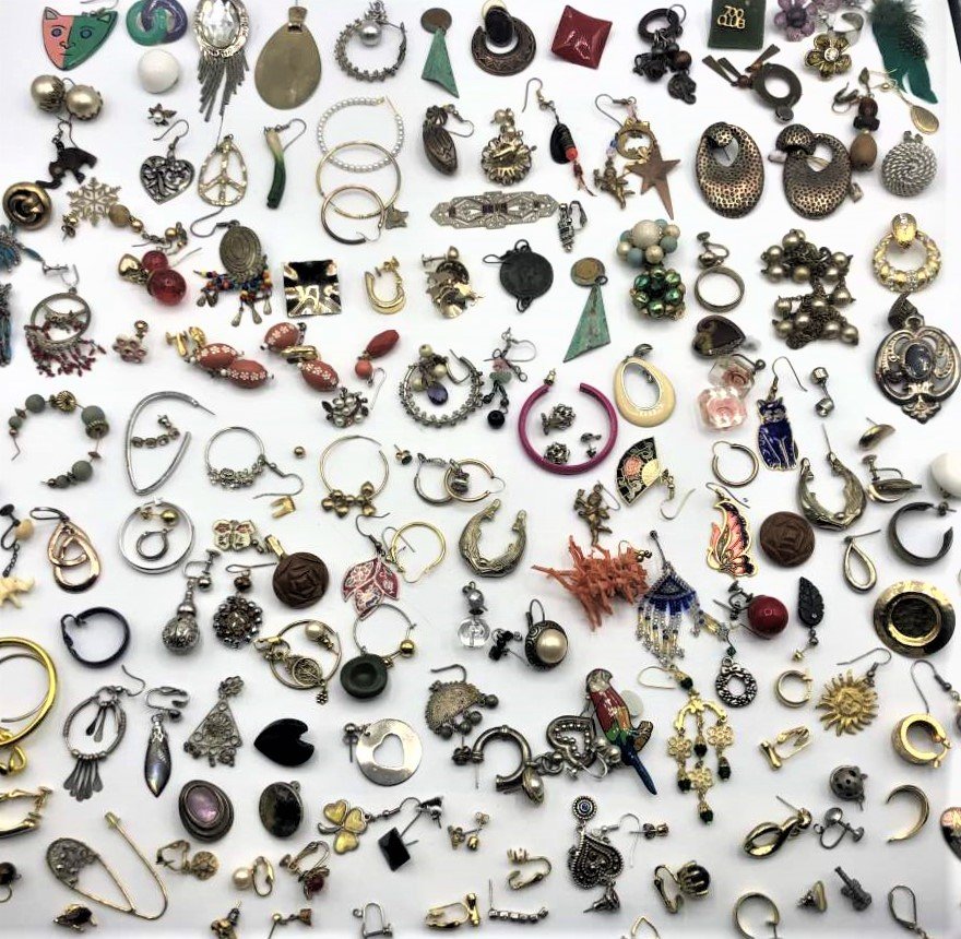 100 Plus Pieces of Odd Single Costume Jewelry Earrings: 100 Plus Pieces of Odd Single Costume Jewelry Earrings. Great deal for the Arts and Crafts people. Huge Variety.