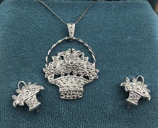 Rhodium Plated Sterling Marcasites Basket Flowers Set: Rhodium Plated Sterling Marcasites Basket of Flowers Necklace and Earrings Set in Original box. Marked: Sterling. Size: basket pendant 1 1/8 in. ; chain 19 in. ; Earrings 5/8 in.