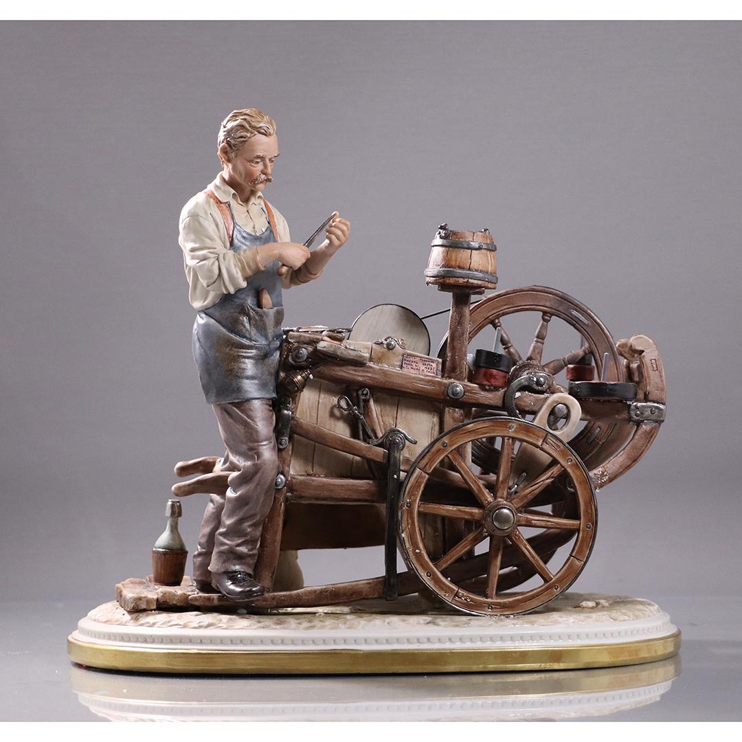 Capodimonte Porcelain Grouping Man Tool Sharpening Cart: Capodimonte Porcelain Grouping Man Tool Sharpening Cart. Size: 11.5 in. height x 15 in. length