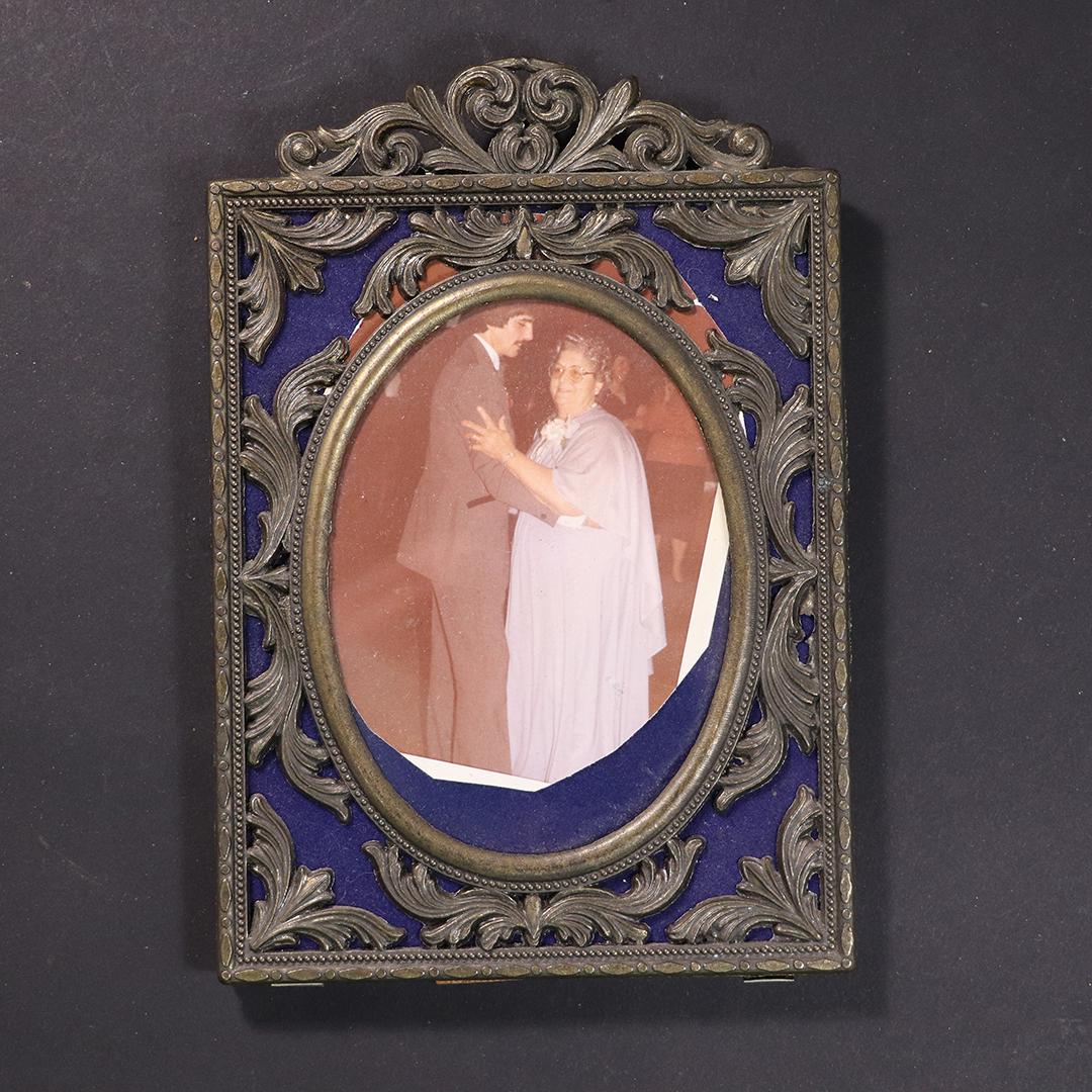 Vintage Italian Renaissance Metal Picture Frame: Vintage Italian Renaissance Metal Picture Frame, picture is oval, marked: Made in Italy. Size: 7.5 in. x 5 in. outside of frame