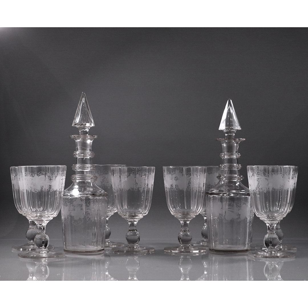 19th C. 8 Glass Stem Goblets, 2 Decanters Etched Grapes: 19th C. 8 Glass Stem Goblets, 2 Decanters Etched Grapes. Minor nicks on glasses, decanter have some edge roughness. Old and Antique. Size: 6.5 in. - 11 in. range in height