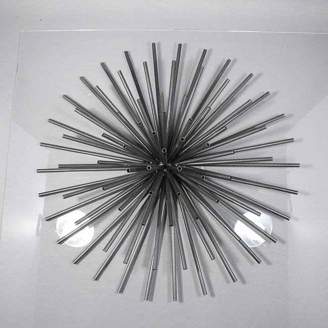 Modern Design Tube Metal Starburst Wall Sculpture: Modern Design Tube Metal Starburst Wall Sculpture.Size: 5 1/2 in. height x 20 in. diameter