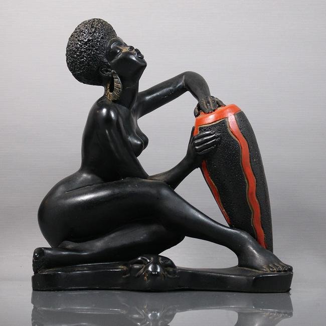 Nude African Woman Chanting Playing Drum by Marwal Ind.: Nude African Woman Chanting Playing Drum by Marwal Ind., signed. Made of Hard Composition, original finish.Size: 12.5 in. height 11.5 in. wide