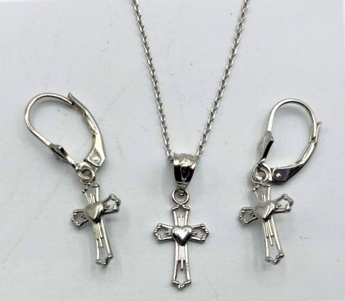 .925 Sterling Silver Cross Necklace and Cross Earrings: .925 Sterling Silver Cross Necklace and Cross Earrings set. Marked: .925 Size: Cross pendant 1/2 in. Chain 18 in. length; earrings 1/2 in.