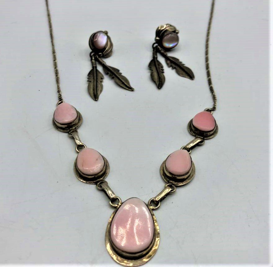 .925 Sterling and Rhodonite stones Necklace, Earrings: .925 Sterling and Rhodonite stones Necklace, Earrings. Marked: .925 ; Size necklace 5 stone pendant 4.25 in. length, chain 15 in. length. Feather drop earrings 1.75 in. length