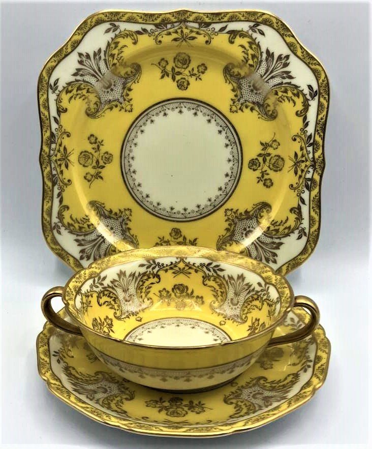 Noritake, 3 Piece Yellow and Gold Place Setting: Noritake, 3 Piece Yellow and Gold Place Setting. Size: dinner plate 8.25 in; saucer 6.75 in. handled bowl 5 1/8 in. small flea bite on bowl rim.