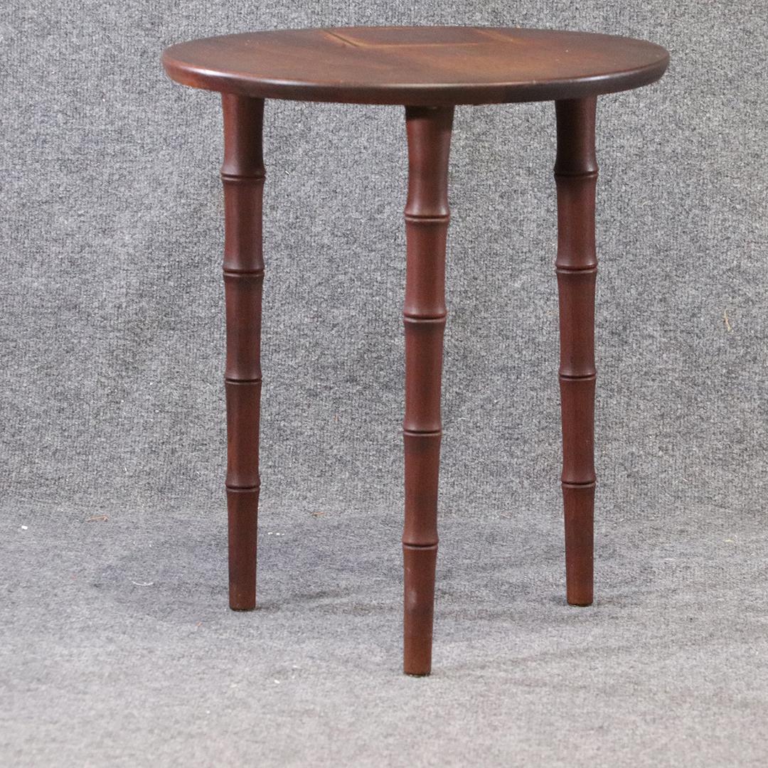 Small Round Wood Table on Three Legs. Brass Hardware: Small round wood table on three legs. brass hardware. vintage. Size: 21 in. height x 18 in. diameter
