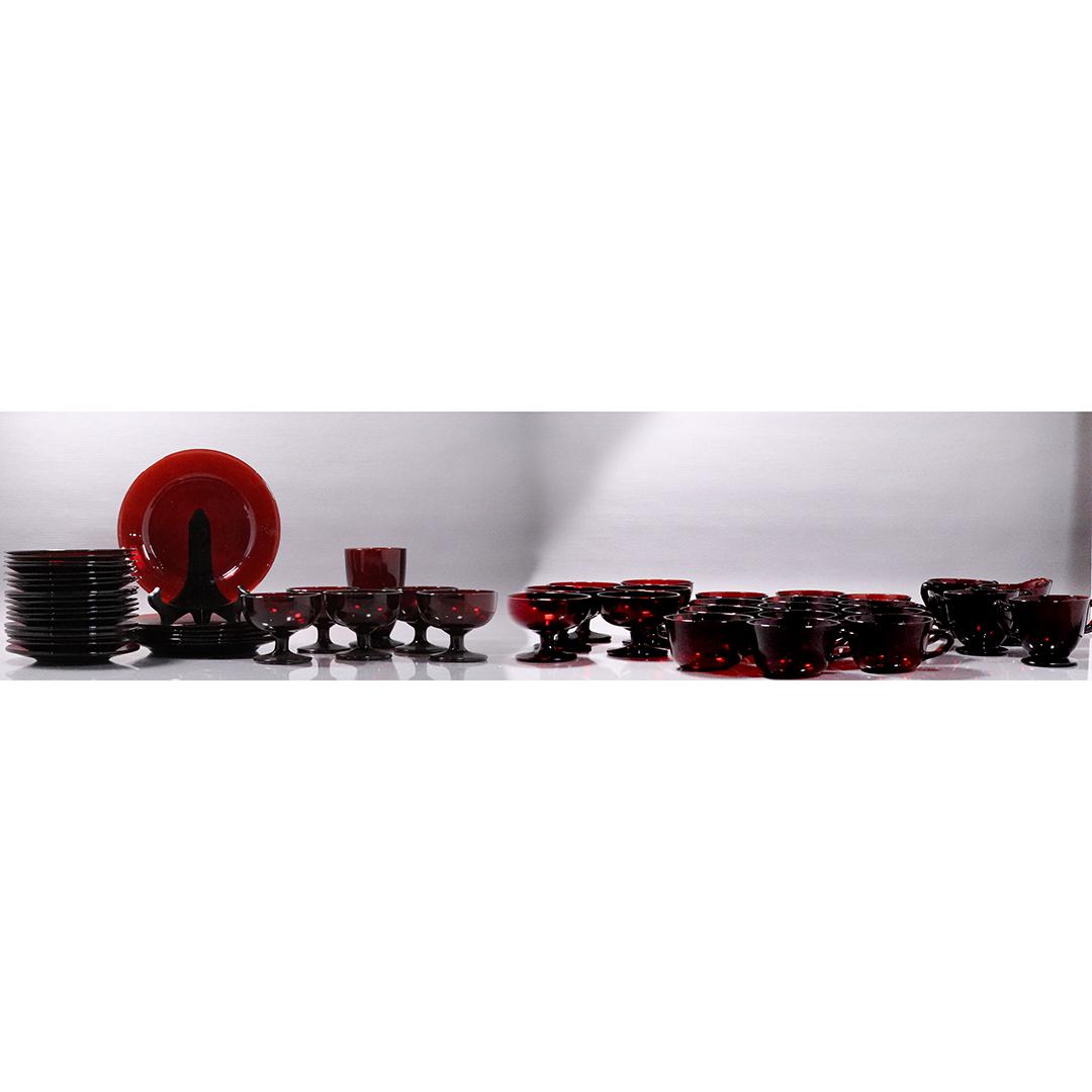 61 Pieces of Ruby Red Glass Dinnerware - Big Variety: 61 Pieces of Ruby Red Glass Dinnerware - Big Variety, Size: 8 in diameter plates (6x), 6 in. diameter saucers (18x), (11x lifted glasses), (1x) goblet, (12x sets sugar and creamer, (13x cups)