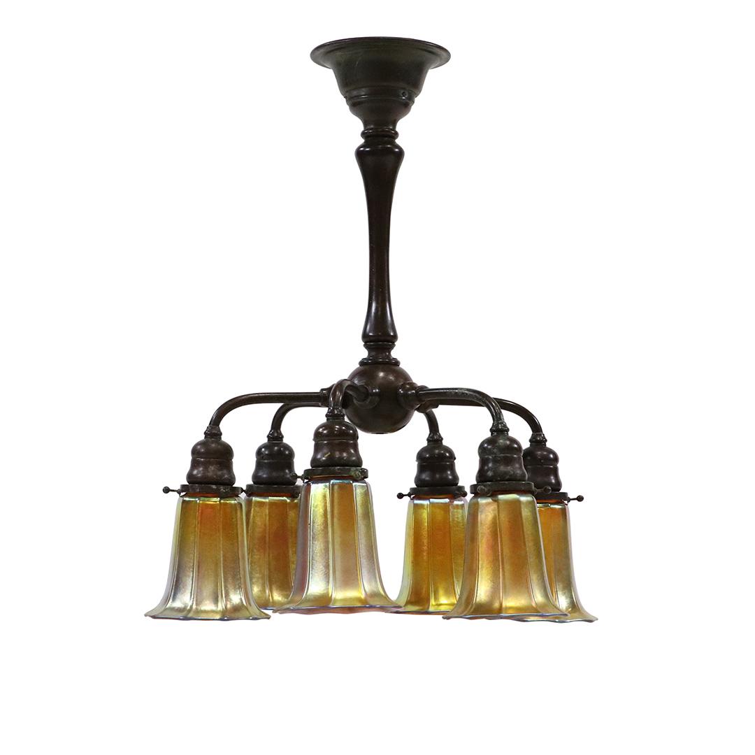 TIFFANY Bronze 6 Arm Chandelier 6 Signed Steuben Shades: TIFFANY Bronze 6 Arm Hanging fixture Chandelier 6 Signed Steuben Shades. Good bronze patina. All 6 glass shades are signed STEUBEN. Wiring is good. Size: 18 in. height, 16 in. diameter without shades,