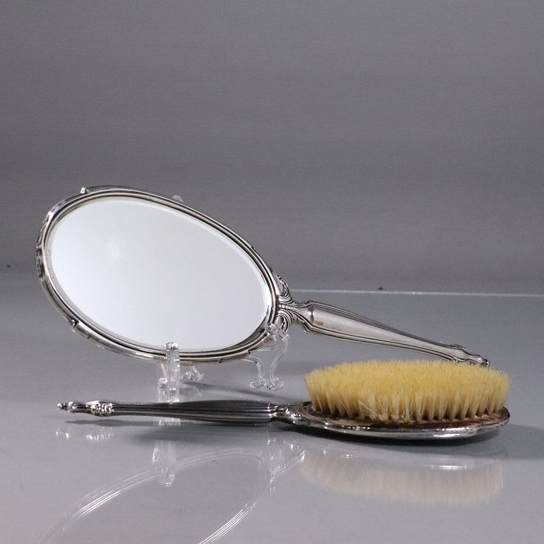 Vintage Sterling Silver Hand Mirror and Hand Brush: Vintage Sterling Silver Hand Mirror and Hand Brush. Marked: Sterling. Size: 13 in. length and 10 in. length