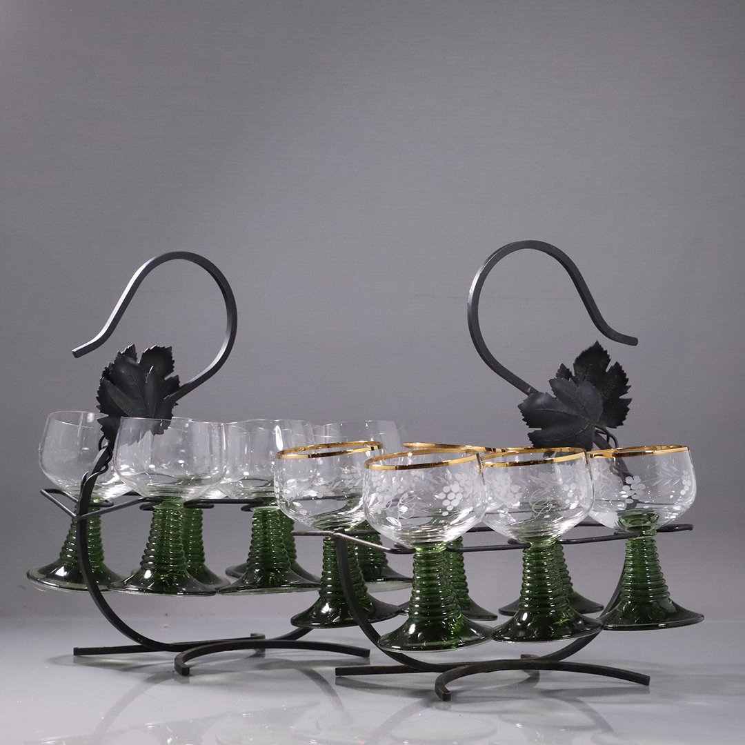 2 Sets of Six - 12 Green Stem Wine Glasses in Holders: 2 Sets of Six - 12 Green Stem Wine Glasses in Metal Holders. Glasses are etched with grapes and leaves. Size: 4.25 in. height each