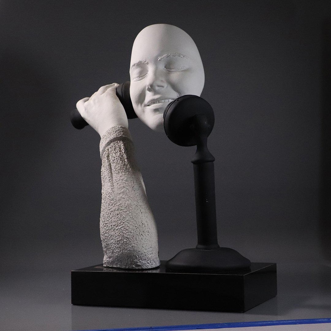 Signed Cutrone Plaster Sculpture Talking on Stick Phone: Signed Cutrone Plaster Sculpture Talking on a Stick Phone. Black and White, hard plaster composition, Signed: Cutrone. Size: 18 in. height, 17 in. wide