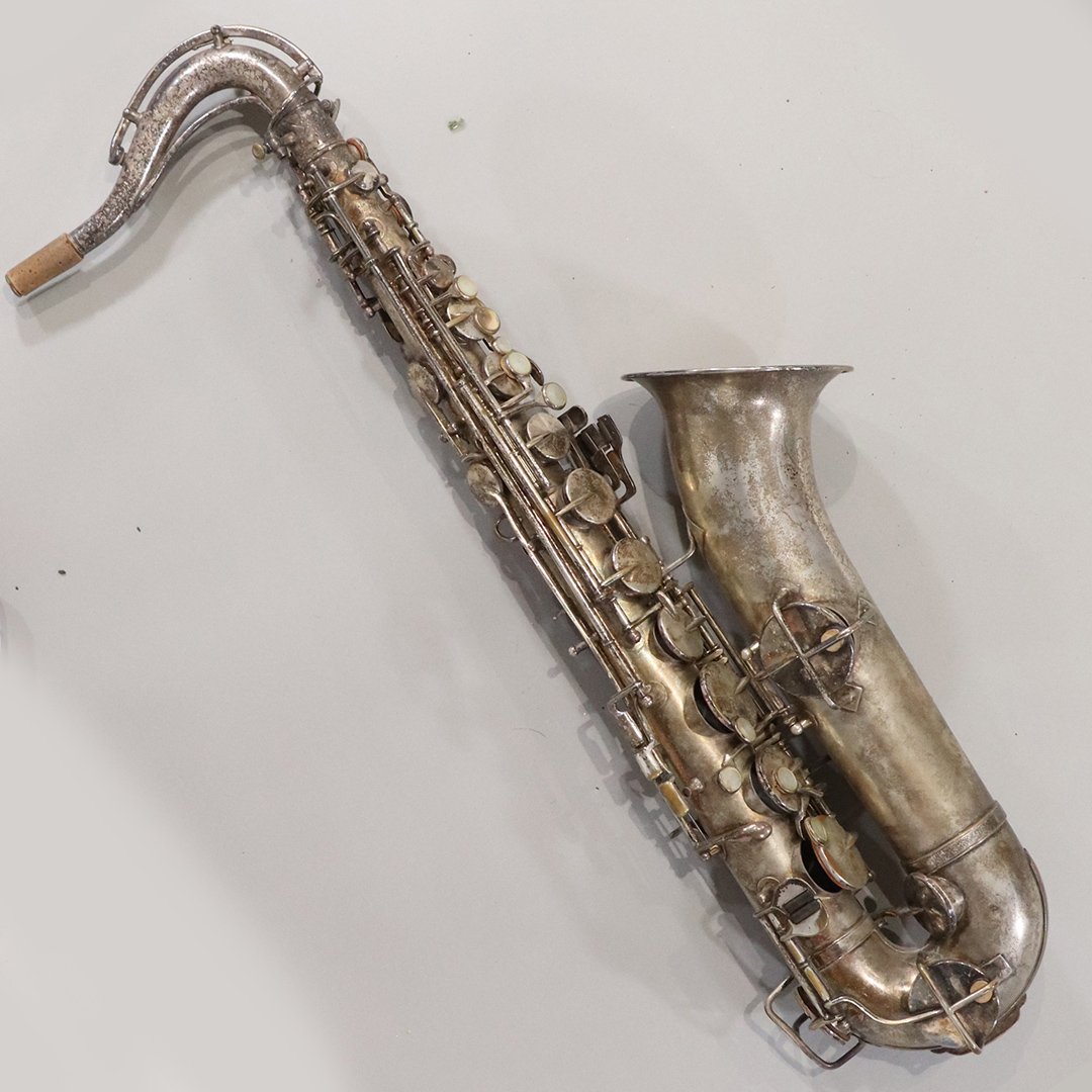 KING W H White Low Pitch 50821 Vintage Saxophone & Case: KING W H White Low Pitch 50821 Vintage Saxophone & Case. Silver finish saxophone. Circa 1915. Size: 27 in. length, 5.5 in. wide; fitted case is 26.5 in. length x 10 in. wide