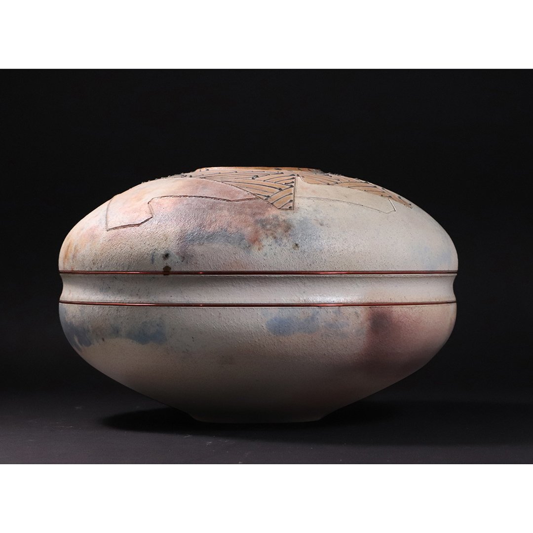 Andakon Signed Southwestern Studio Pottery Vase: Andakon Signed Southwestern Studio Pottery Vase. Signed on base Andakon 88 ; Hand made, wire rings , small nick. Size: 7 in. height, 11.5 in. wide, 3.5 in. opening at top.