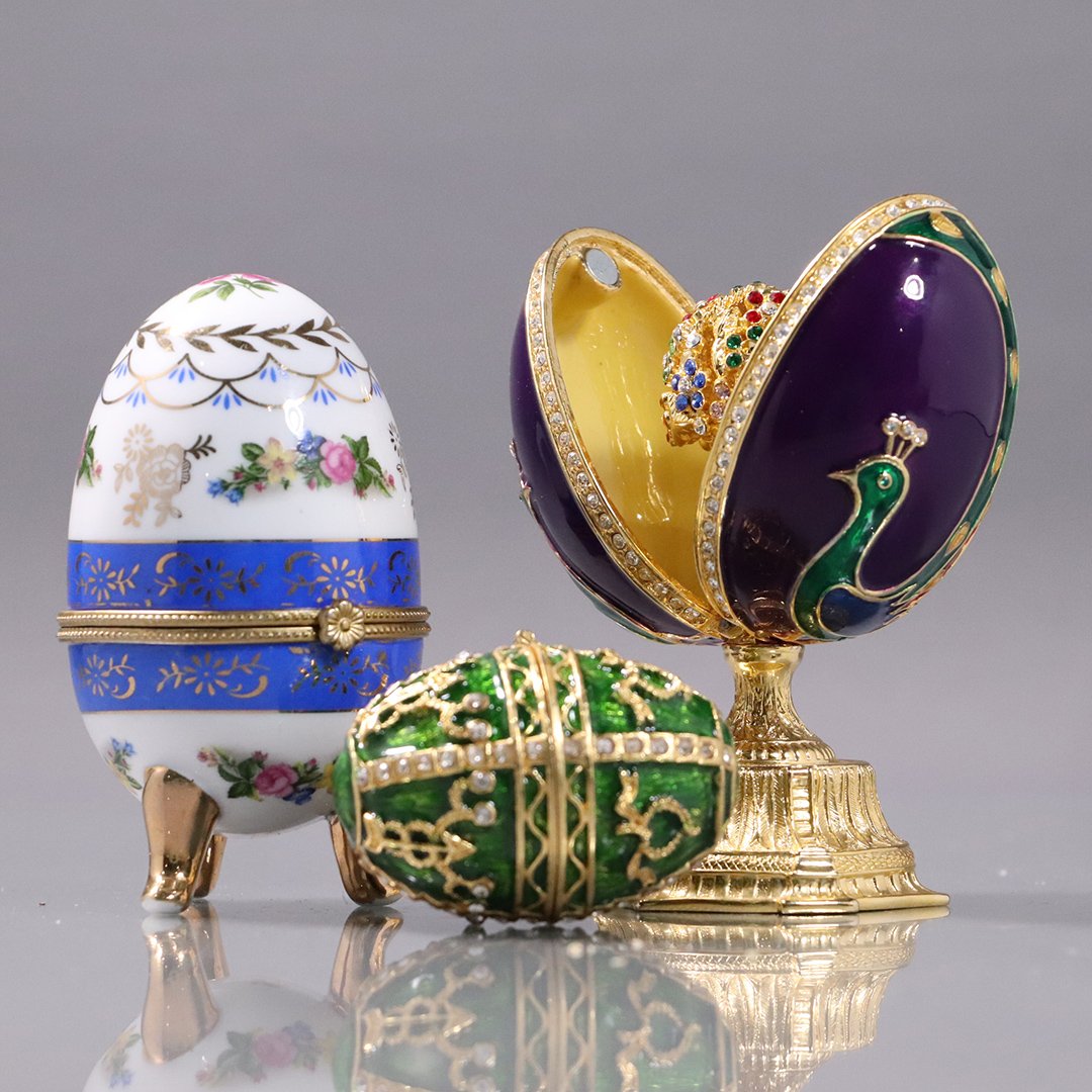[3] Decorative Faberge Style Eggs, Enameled, Porcelain: [3] Decorative Faberge Style Eggs, Enameled, Porcelain. Two are metal with enameled decoration, other is porcelain and decorated. Size: range from 2 in. to 4.5 in. in heights