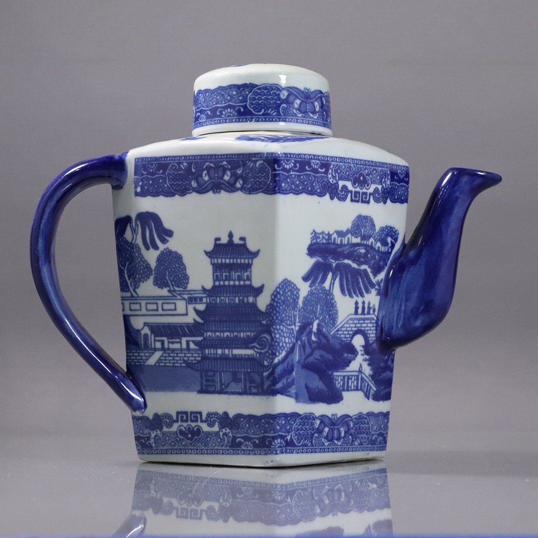 Blue Willow Pattern Blue & White Ironstone Tea Pot: Blue Willow Pattern Blue & White Ironstone Tea Pot. Marked on base. Size: 8 in. height, 9.5 in. wide