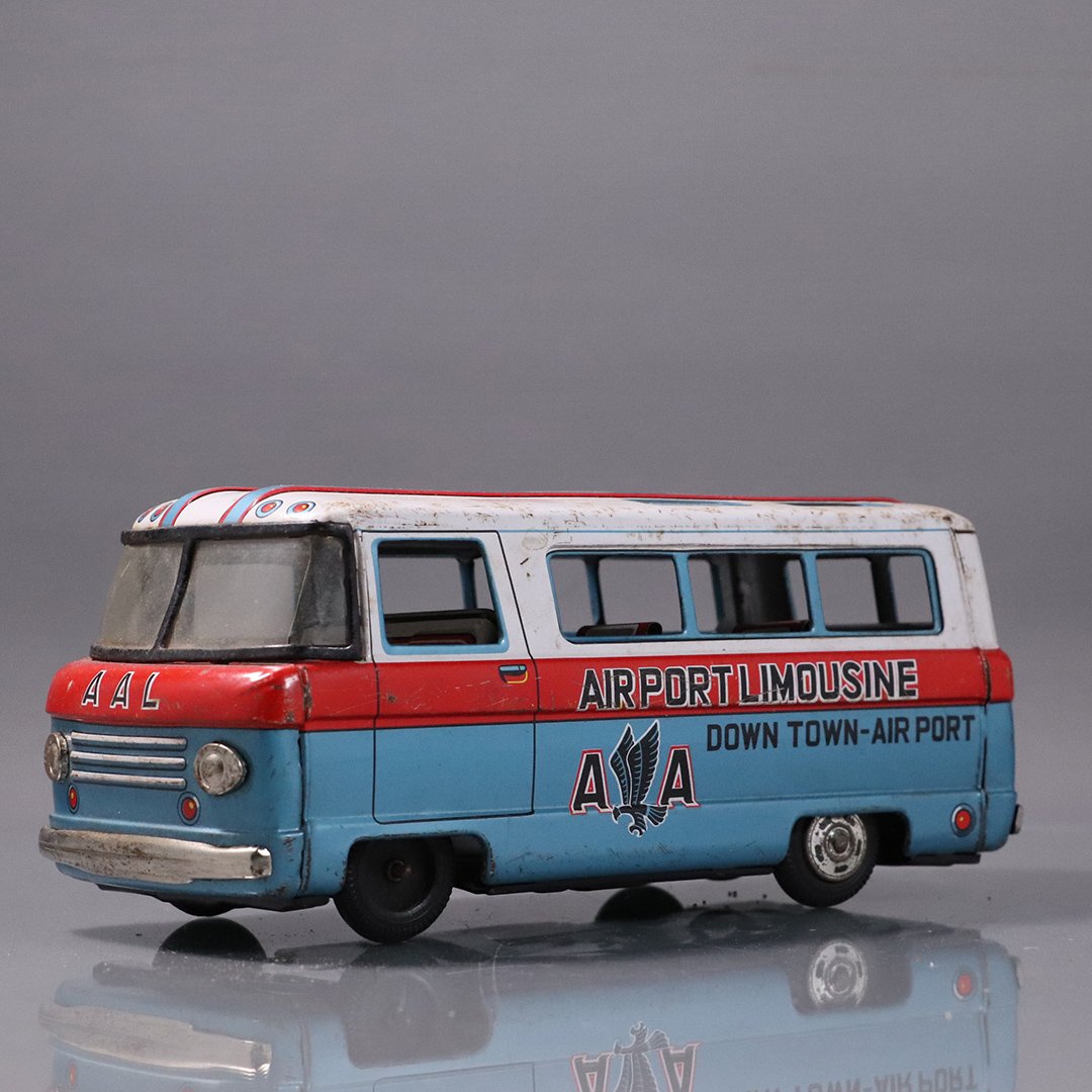 Vintage Japan Tin Friction Toy: Airport Limousine Bus: Vintage Japan Tin Friction Toy: Airport Limousine Bus. AA Downtown Airport. Circa 1960s. Size: 4 in. height, 9.5 in. length