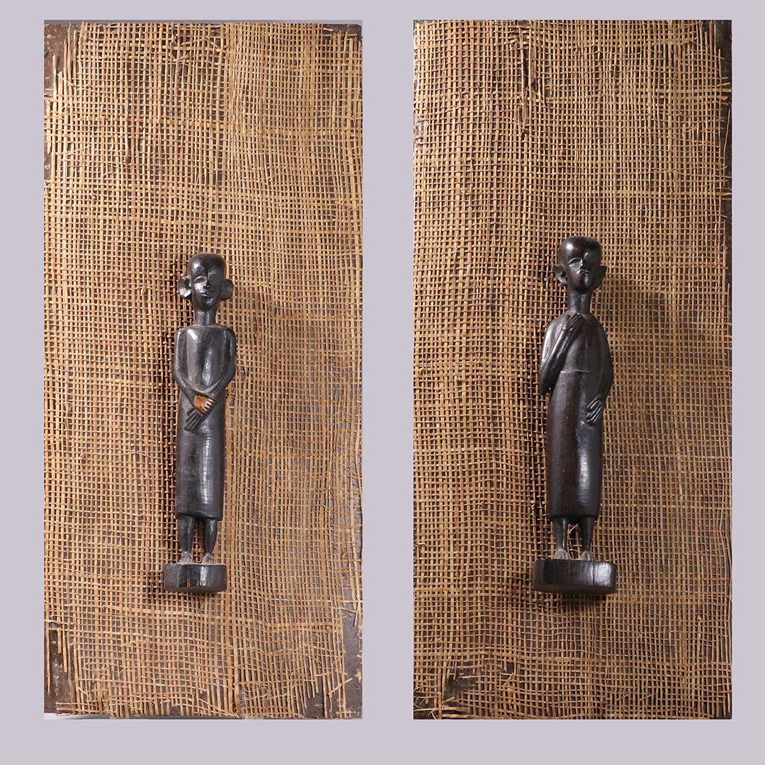 2 Carved Teak African Figures Mounted on Burlap Boards: 2 Carved Teak African Figures Mounted on Burlap Boards. Ebony Teak Wood, hand carved. Size: figures are 9 in. height, burlap covered board backings are 18 in. x 9.5 in.