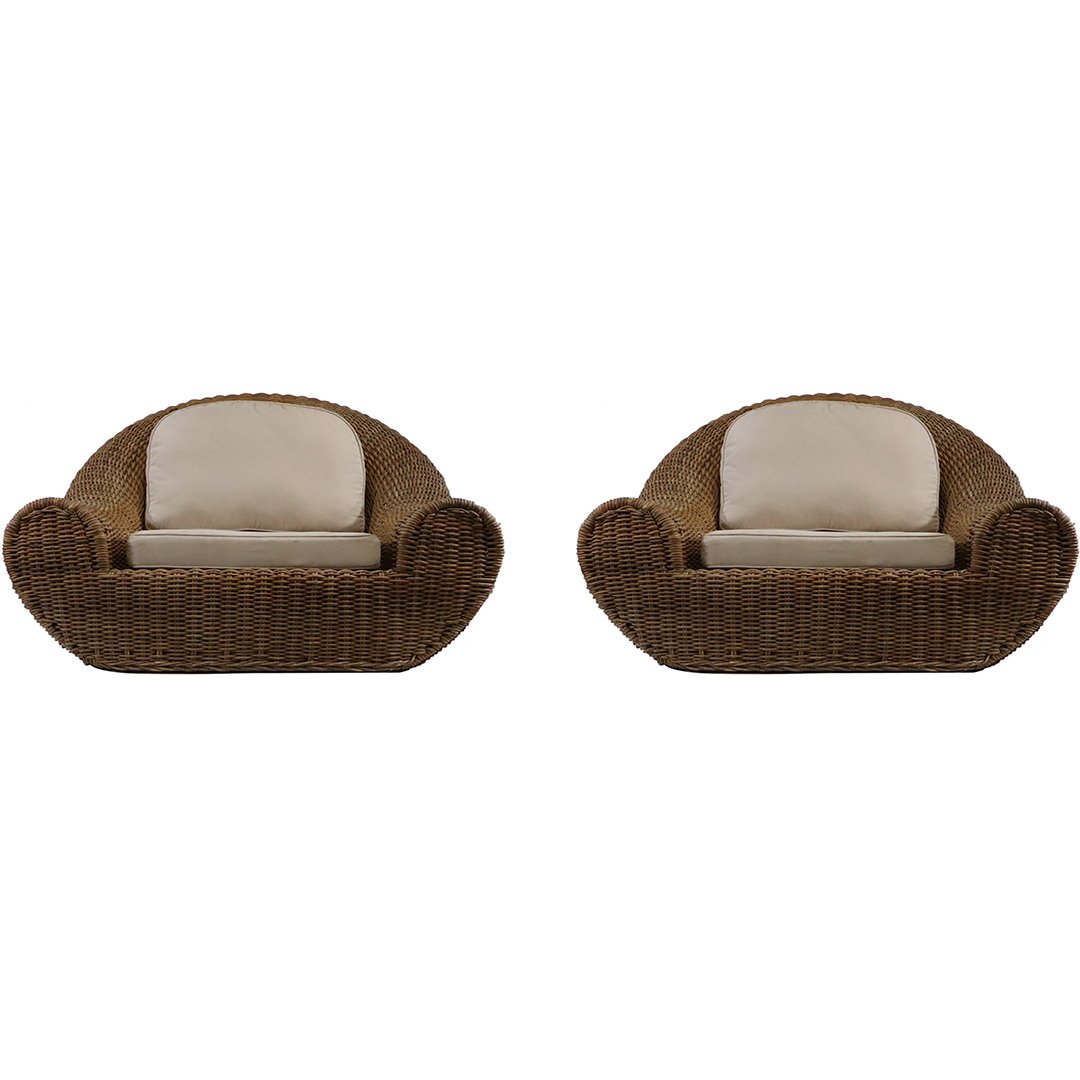 Pair Karl Springer Style Wicker Pullman Lounge Chairs: Pair Karl Springer Style Wicker Pullman Lounge Chairs. Both have cushions, Natural finish, Sturdy wicker construction. Vintage. Mid-Century Modern. Size: 33 in. height, 49 in. wide, 40 in. depth, 15 i