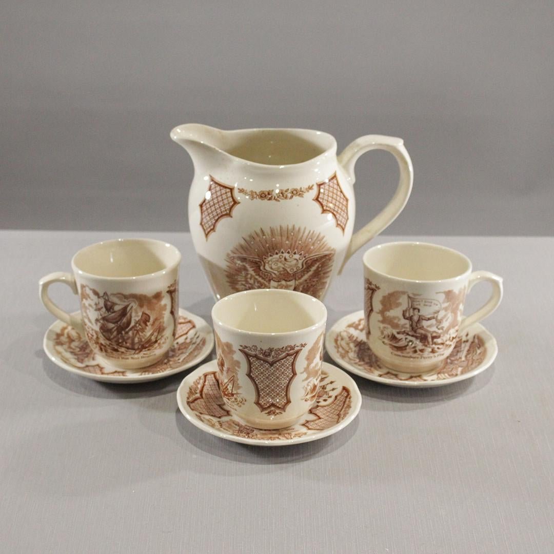 Alfred Meakin Staffordshire England "Fair Winds" 7 pcs.: Alfred Meakin Staffordshire England "Fair Winds" 7 pcs. to include Pitcher, 3 cups, 3 saucers. Historical Scenes depicting Chinese Export to America.Size: 5.5 diameter of saucer, 3.5 h cup, 7.25 h pit