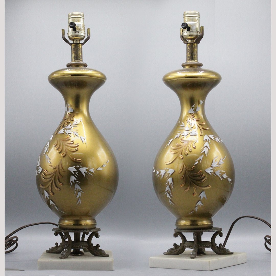 Pair Italian Gold Glass Table Lamps Decorated Accents: Pair Italian Gold Glass Table Lamps Decorated Accents. Vintage. Harps included. Mounted on white marble bases.Size: 28.5 in. height x 6 inches wide
