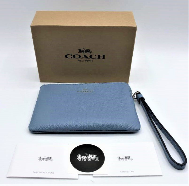COACH Clutch Purse, Soft Blue, Never Used with Box: COACH Clutch Purse, Soft Blue, Never Used with Box. Size: purse 6.25 in. x 4.25 in. ; box 6.6 in. x 4.5 in. x 2 in.